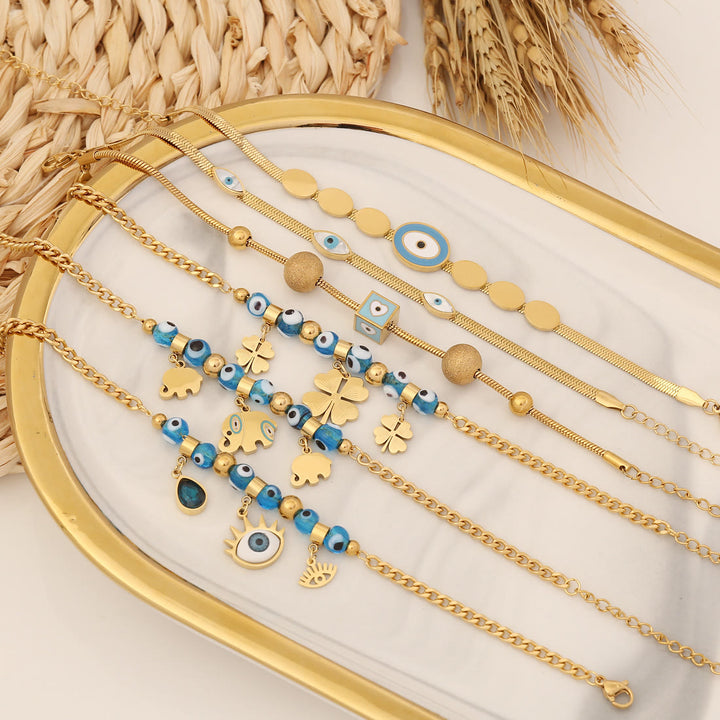 Bracelet porte-bonheur Olivenorma en époxy avec topaze bleue et trèfle mauvais œil