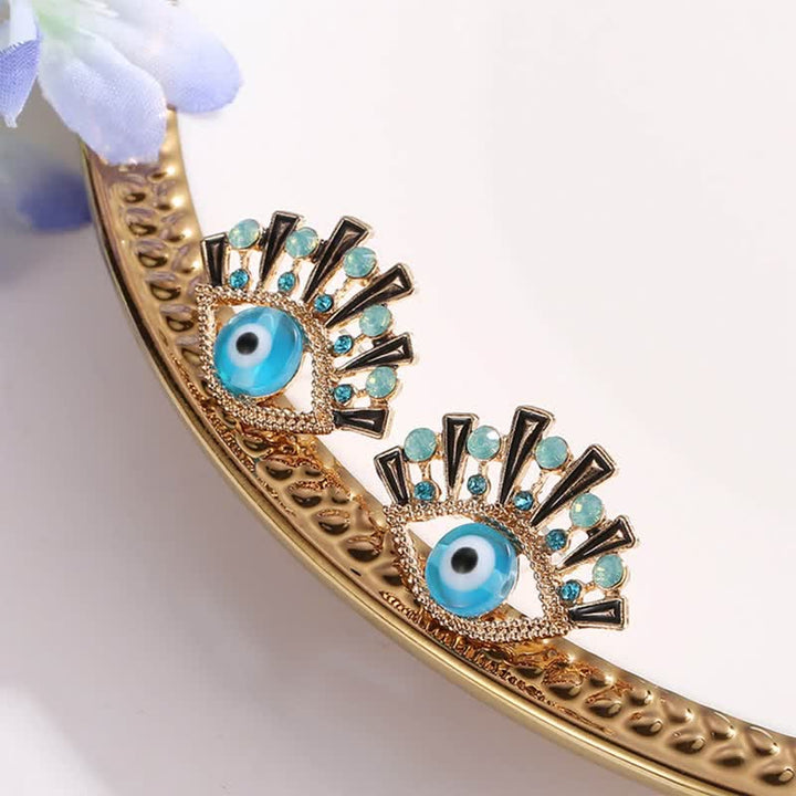 Olivenorma « Eye of Doom » - Boucles d'oreilles paon créatives en saphir