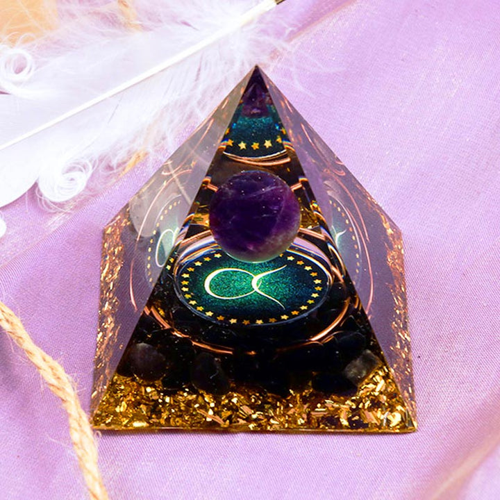 Sphère d'améthyste Olivenorma avec pyramide d'orgone du zodiaque Taureau en obsidienne