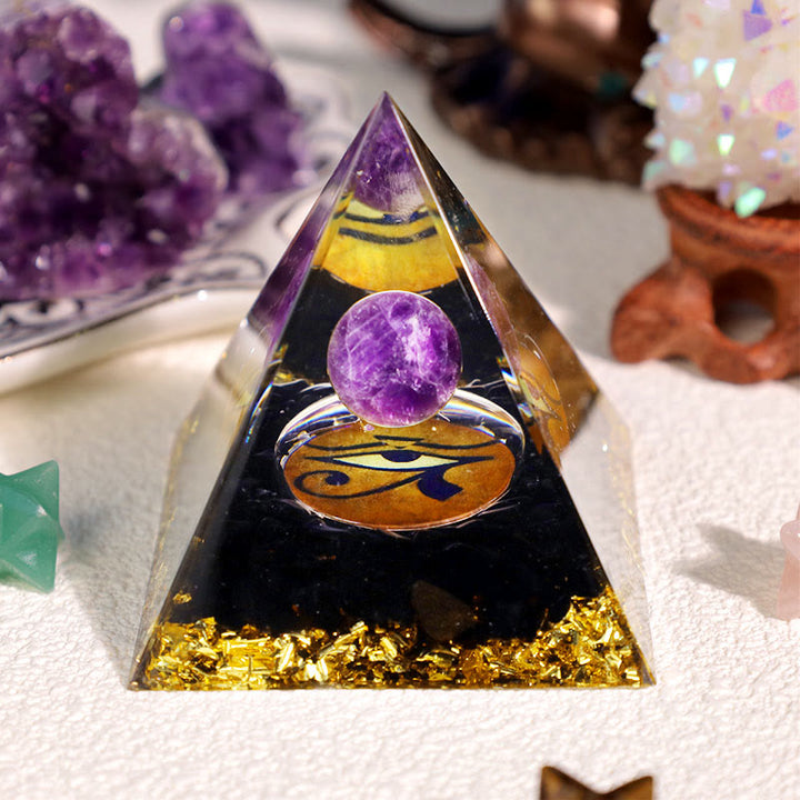 Pyramide d'orgone Oeil d'Horus en obsidienne améthyste Olivenorma