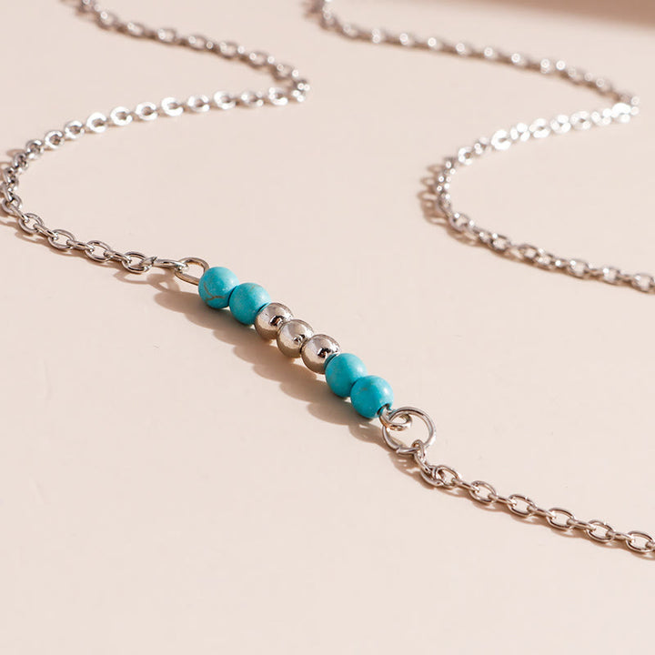 Collier bohème en argent et or avec pendentif en forme de feuille turquoise Olivenorma