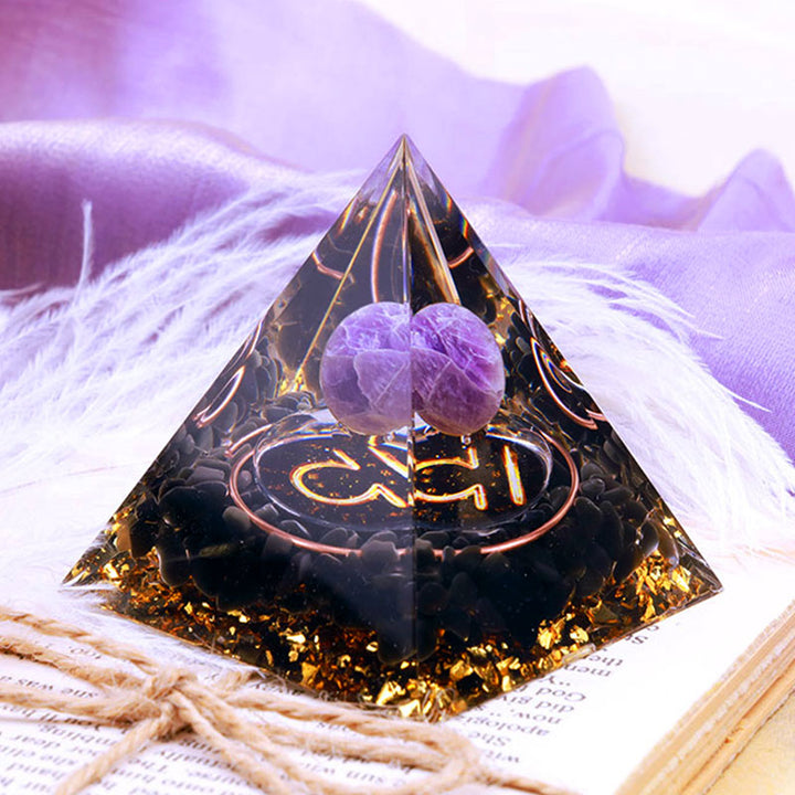 Sphère d'améthyste Olivenorma avec pyramide d'orgone du zodiaque Balance en obsidienne