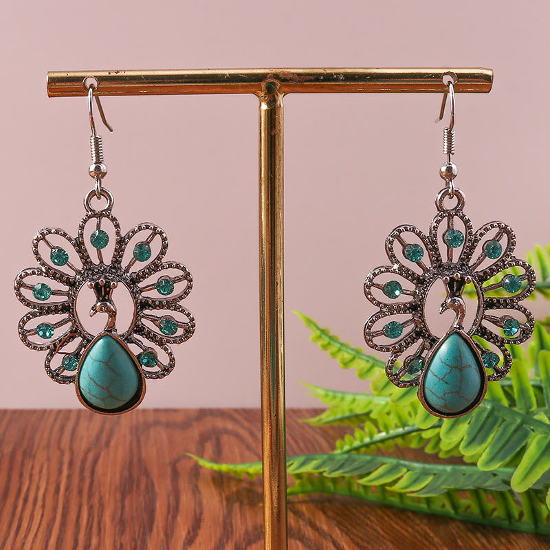 Boucles d'oreilles pendantes en forme de paon avec tourmaline paraiba turquoise Olivenorma