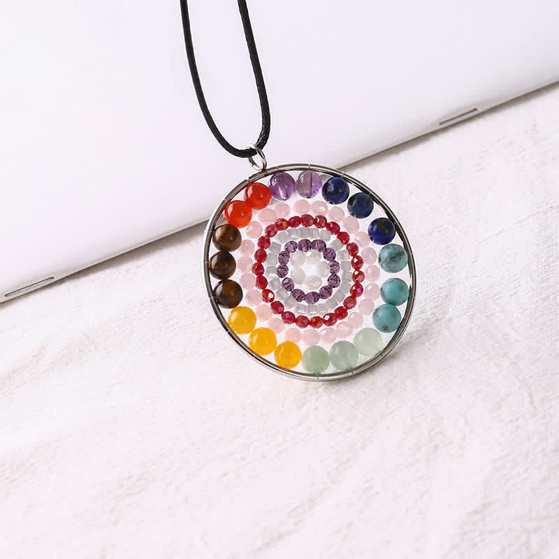 Collier avec pendentif rond en cristal et fleur de datura Olivenorma