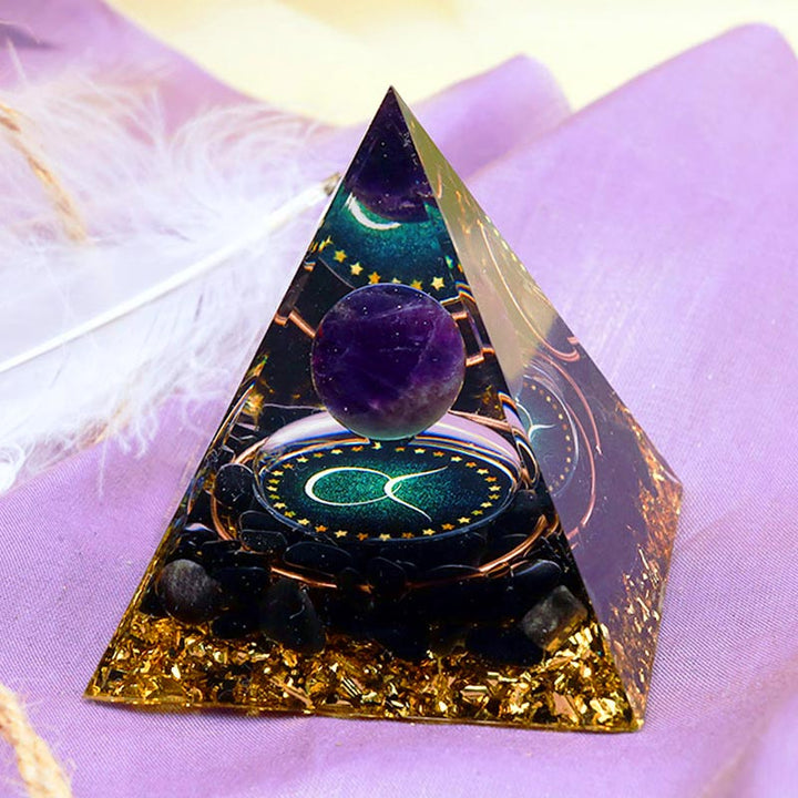 Sphère d'améthyste Olivenorma avec pyramide d'orgone du zodiaque Taureau en obsidienne