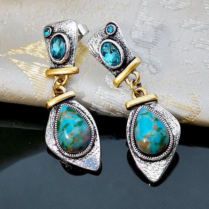 Boucles d'oreilles en argent avec topaze bleue et pierre empereur Olivenorma 