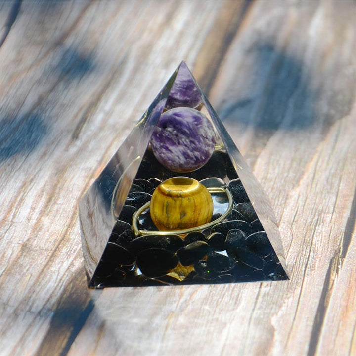 Sphère d'améthyste Olivenorma avec pyramide d'orgone en obsidienne œil de tigre 