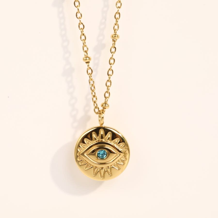 Collier Olivenorma en acier titane 316L avec topaze bleue et mauvais œil 