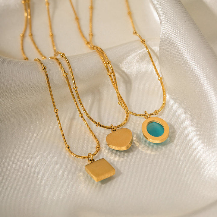 Collier pendentif carré en forme de cœur avec pierre œil de chat bleu Olivenorma 