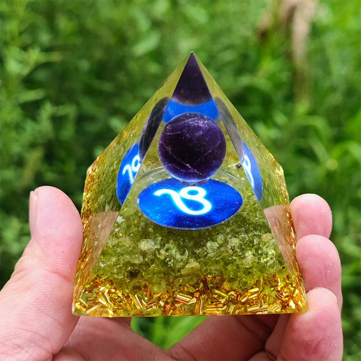 Pyramide d'orgone du zodiaque Lion en améthyste Olivenorma avec péridot