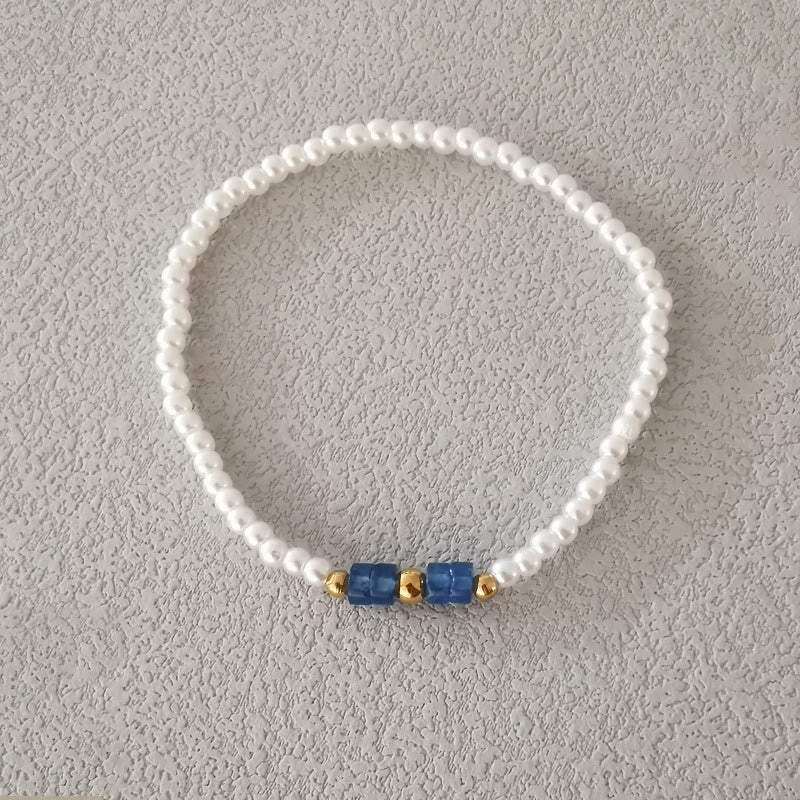 Ensemble de quatre bracelets en perles de cristal naturel Olivenorma