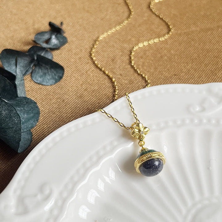 Collier pendentif en forme de sphère en grès bleu malachite « Stellar Corona » Olivenorma