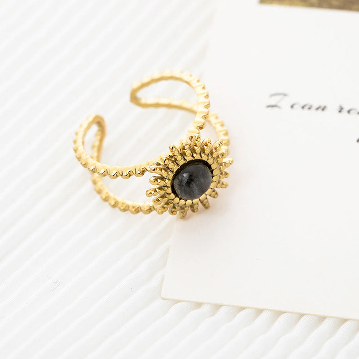 Bague Olivenorma en forme d'étoile à huit branches et à double rangée de tournesols 