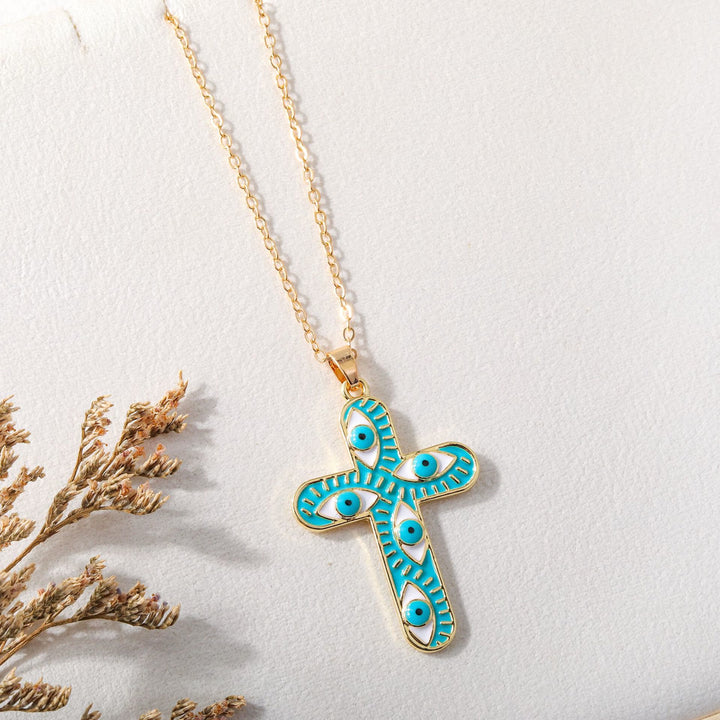 Collier Croix Mauvais Œil Olivenorma « Nous sommes protégés »