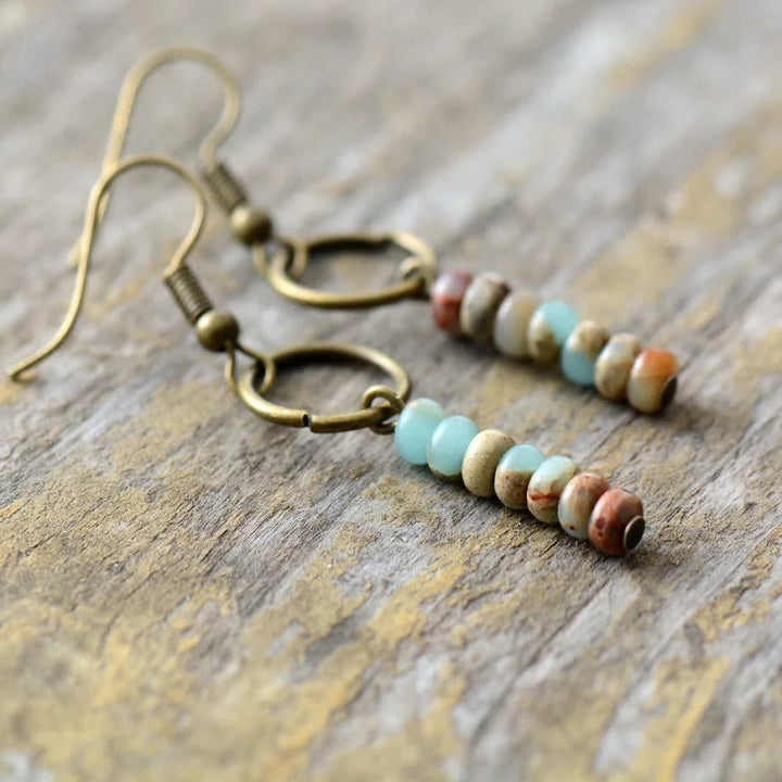 Boucles d'oreilles en perles de roue en quartz fraise, bronzite et agalmatolite Olivenorma