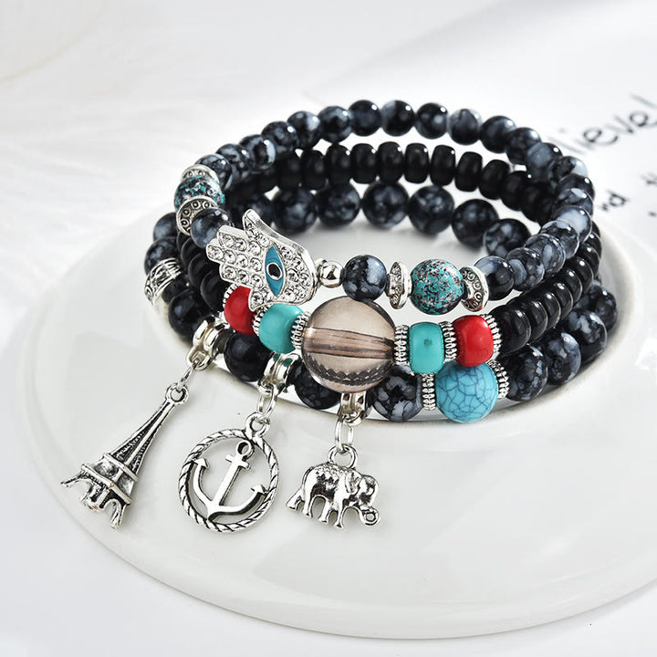 Ensemble de bracelets Hamsa contre le mauvais œil avec la tour de l'éléphant Olivenorma