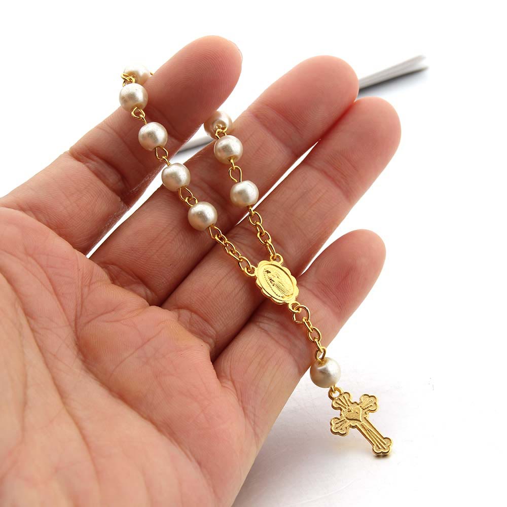 Bracelet en perles et croix en forme de cœur Olivenorma