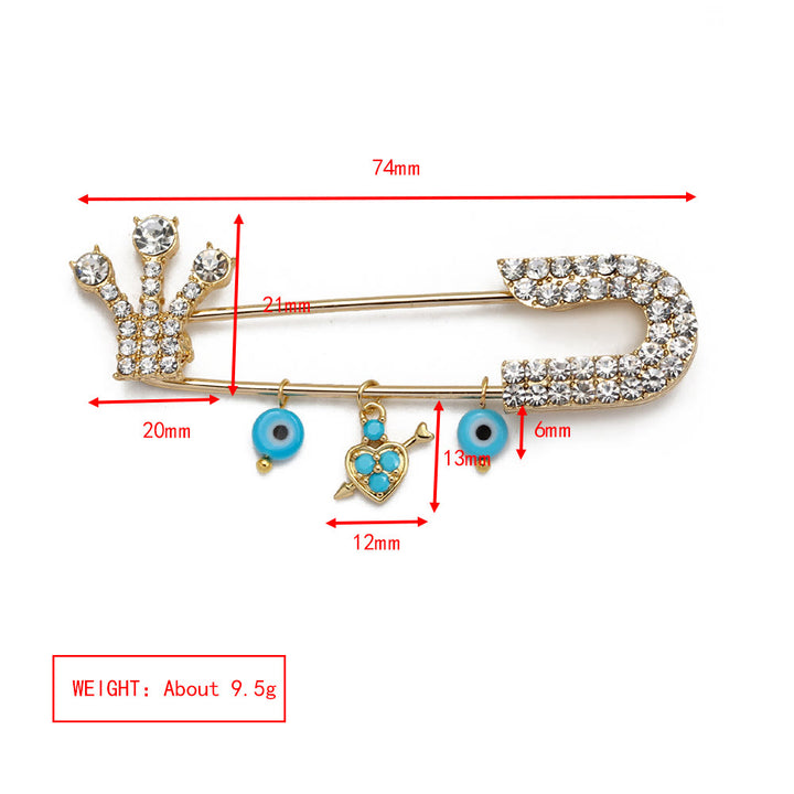 Broche en forme de cœur avec mauvais œil en zircon blanc Olivenorma 