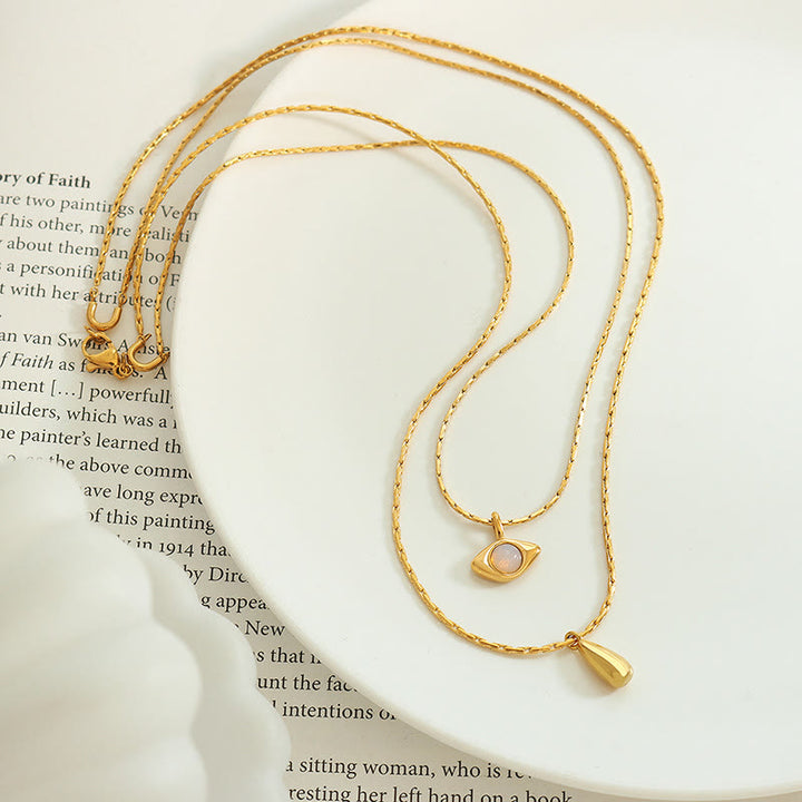 Collier double couche avec pendentif en opalite contre le mauvais œilnorma Olivenorma 
