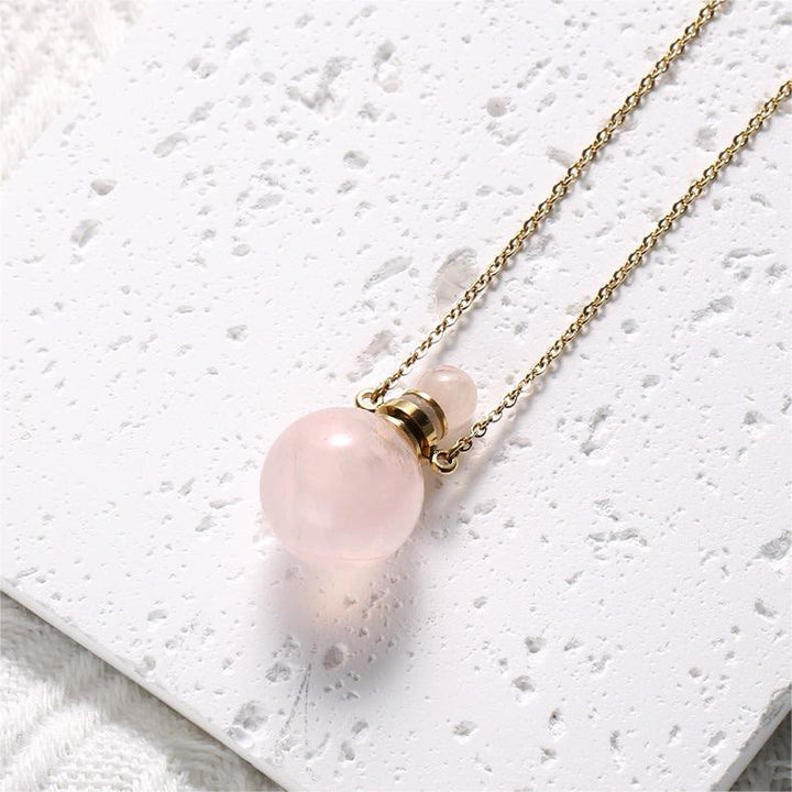 Collier pendentif bouteille de parfum en pierre ronde Olivenorma