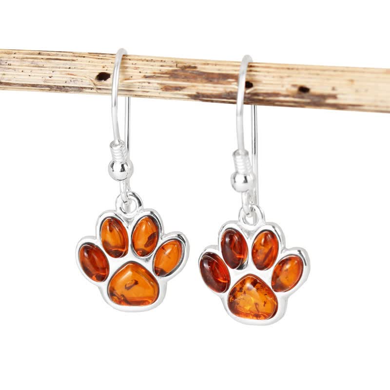 Boucles d'oreilles pendantes en ambre avec empreinte de patte de chien