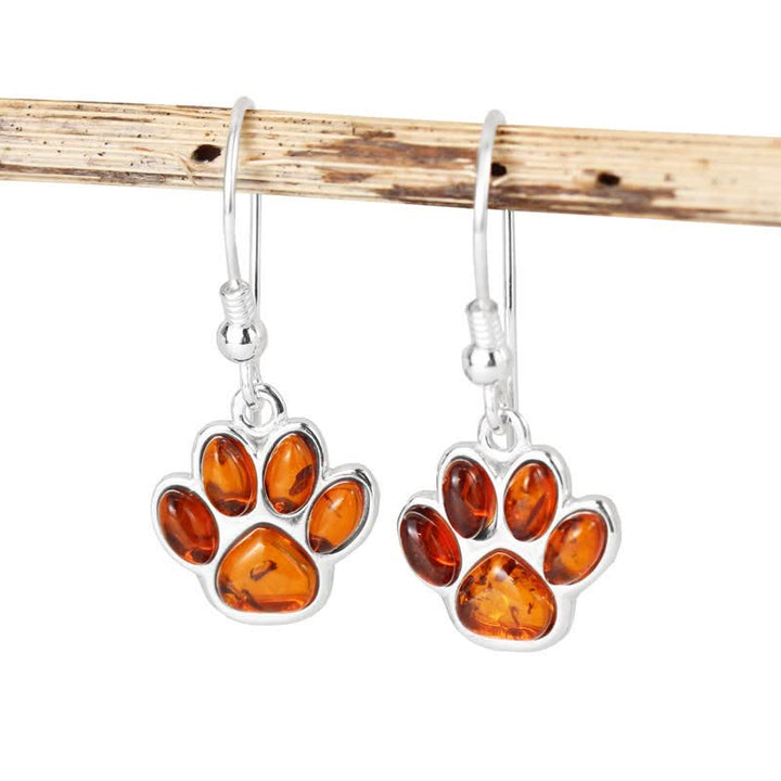 Boucles d'oreilles pendantes en ambre avec empreinte de patte de chien