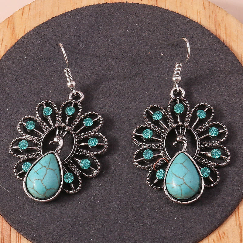 Boucles d'oreilles pendantes en forme de paon avec tourmaline paraiba turquoise Olivenorma