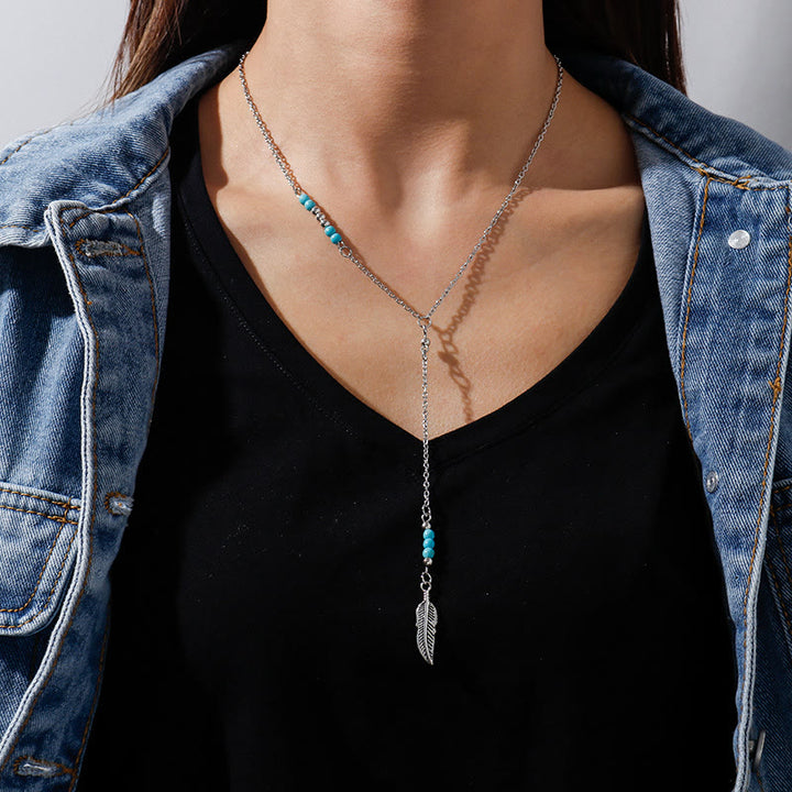 Collier bohème en argent et or avec pendentif en forme de feuille turquoise Olivenorma