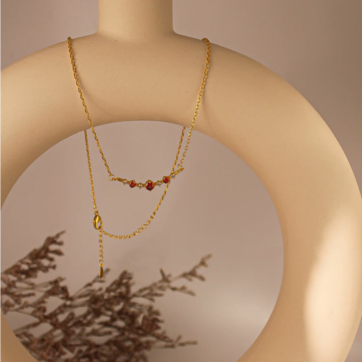 Collier Olivenorma « Symbole d'indépendance » avec diamants et grenats