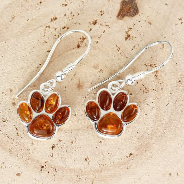 Boucles d'oreilles pendantes en ambre avec empreinte de patte de chien