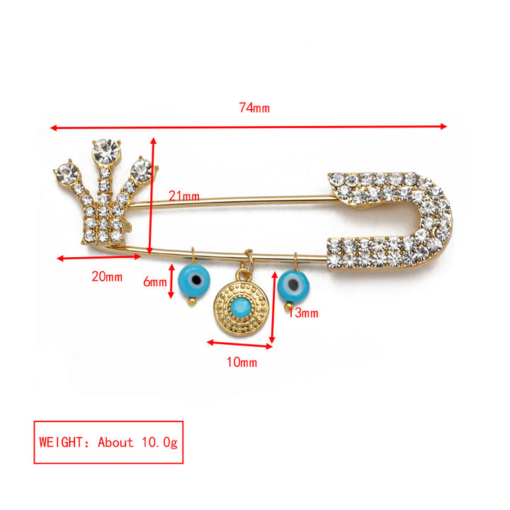 Broche en forme de cœur avec mauvais œil en zircon blanc Olivenorma 