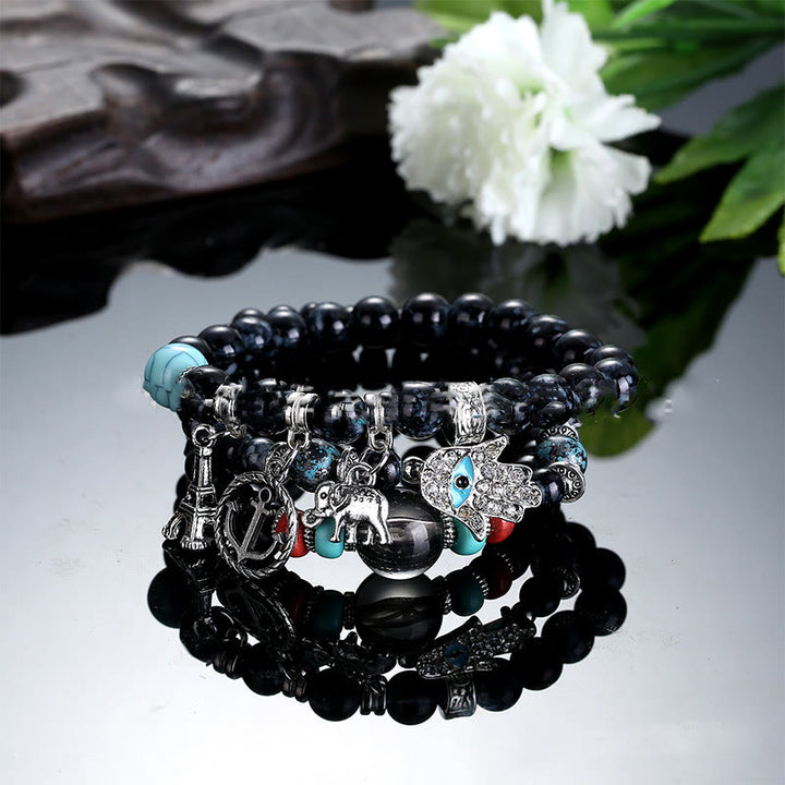 Ensemble de bracelets Hamsa contre le mauvais œil avec la tour de l'éléphant Olivenorma