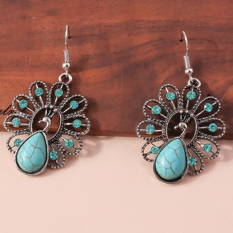 Boucles d'oreilles pendantes en forme de paon avec tourmaline paraiba turquoise Olivenorma