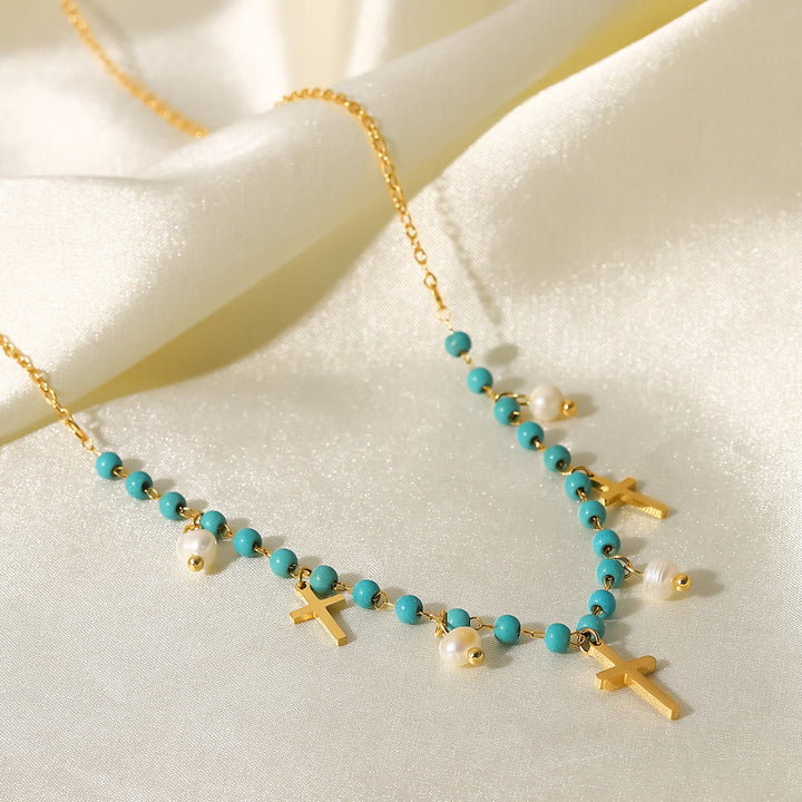 Collier à pampilles avec pendentif en croix et perles turquoise Olivenorma
