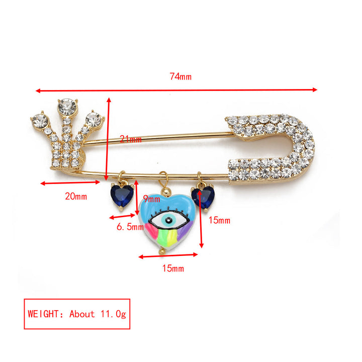 Broche en forme de cœur avec mauvais œil en zircon blanc Olivenorma 