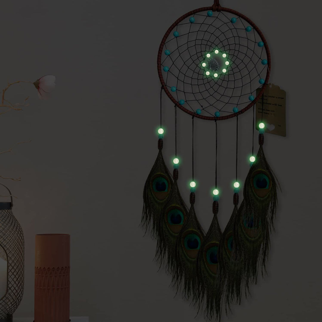 Attrape-rêves en plumes de paon fait main avec perles phosphorescentes Olivenorma