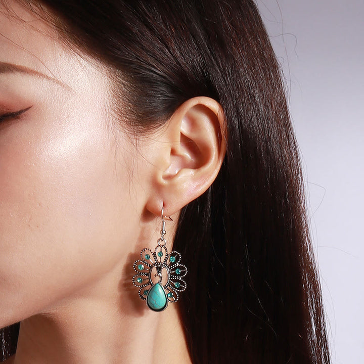 Boucles d'oreilles pendantes en forme de paon avec tourmaline paraiba turquoise Olivenorma