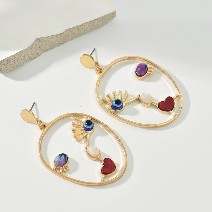 Boucles d'oreilles pendantes en agate rouge avec mauvais œilnorma Olivenorma