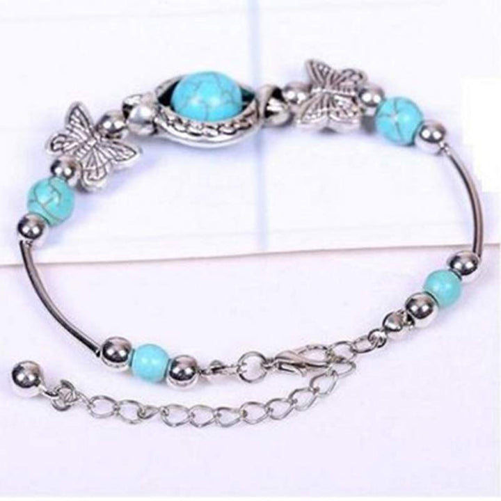 Bracelet papillon en sphère turquoise Olivenorma