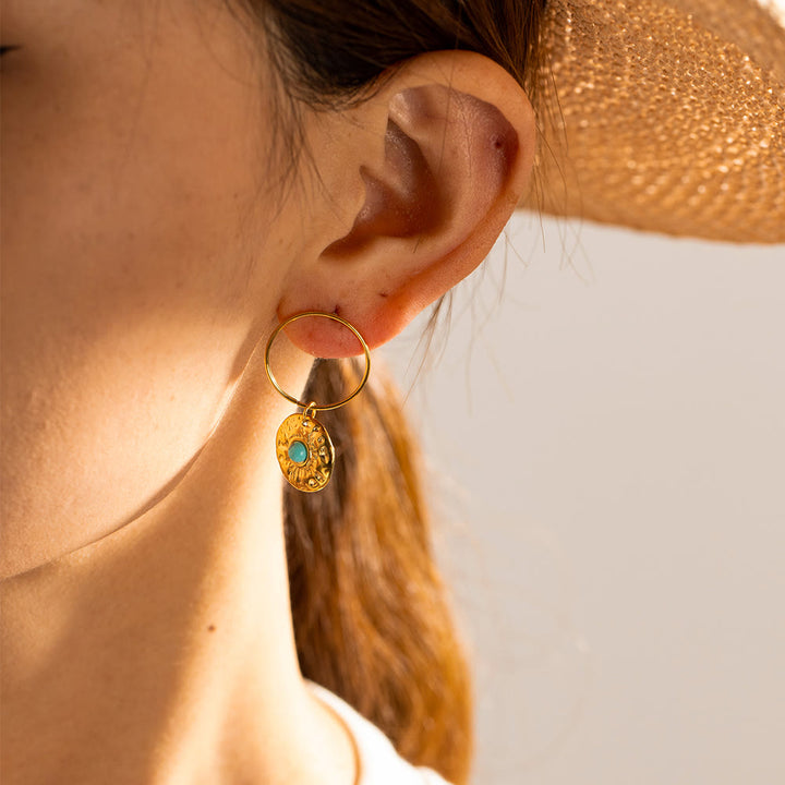 Boucles d'oreilles Olivenorma en acier titane doré et sodalite turquoise
